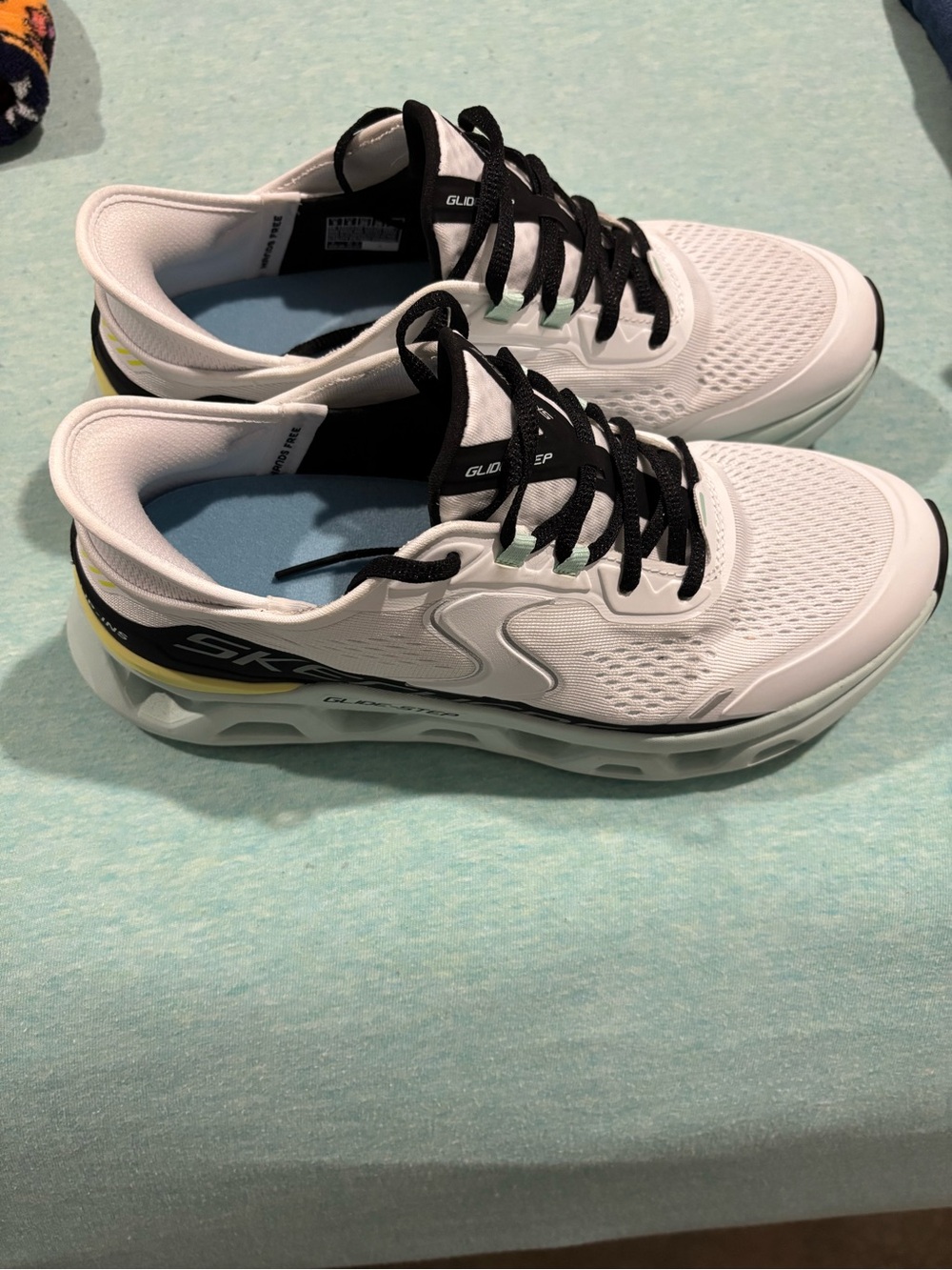 Skechers White Sneakers with Black Laces & Yellow Heel Trim